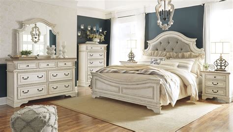 Realyn Chipped Two Tone Upholstered Panel Bedroom Set From Ashley