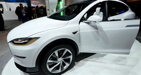 Tesla Model X Electric Crossover Displayed At The Panasonic Booth At