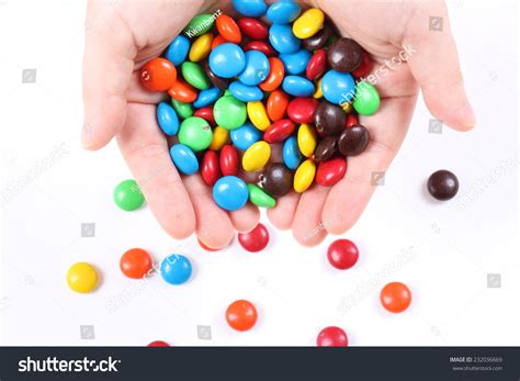 Woman Hands Holding Colorful Chocolate Candies Stock Photo 232036669