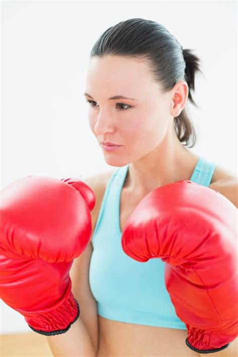 Close Up Of A Beautiful Young Woman In Red Boxing Gloves Stock Photo