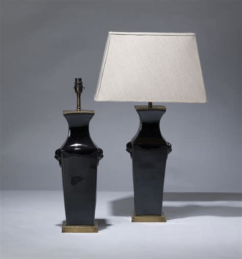 Pair Of Medium Black Ceramic Lamps On Distressed Brass Bases T
