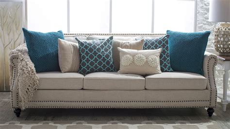 5 ways to decorate a neutral sofa with throw pillows hayneedle throw pillows living room