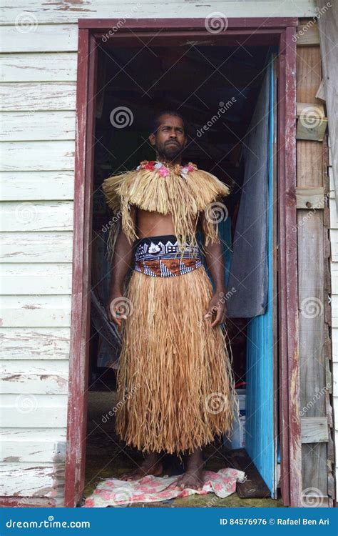 Indigenous Fijian Man Husking A Coconut Fruit In Fiji Royalty Free