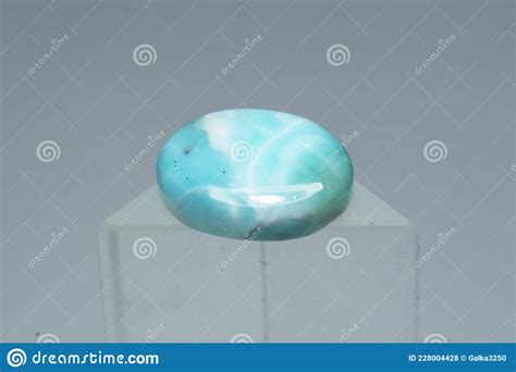 Natural Larimar Stone On A Stand On A White Background Stock Photo