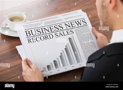 Businessman Reading Newspaper Stock Photo Alamy