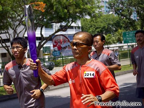 It commemorates the ancient athenian olympic tradition of keeping a flame burning throughout the course of the games. youth-olympic-games-torch-bearer-singapore | Travelerfolio ...