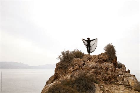 Woman Standing On A Rock Above Sea By Stocksy Contributor Rene De Haan Stocksy