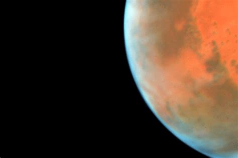 Nasas Hubble Sees Martian Moon Orbiting The Red Planet