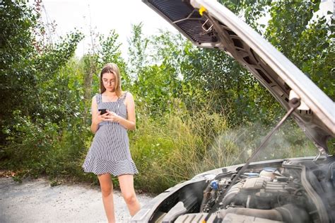 Free Photo The Young Woman Broke Down The Car While Traveling On The