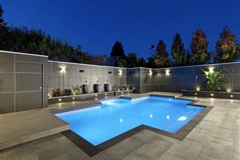 Luxurious And Elegant Swimming Pool Design With Attractive Lighting And