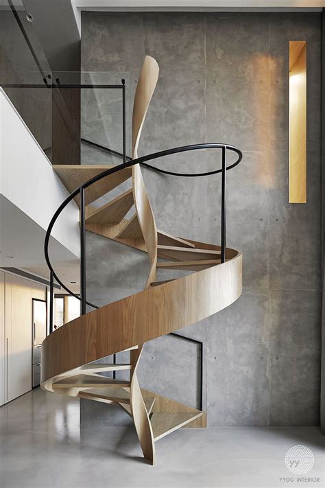 A Sculptural Spiral Staircase Makes A Statement In This Homes Interior