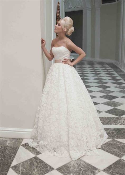 While your wedding dress is undeniably the most important piece of your wedding day look, a veil has the power to pull your whole ensemble together. Stunning yet simple lace strapless ballgown wedding dress