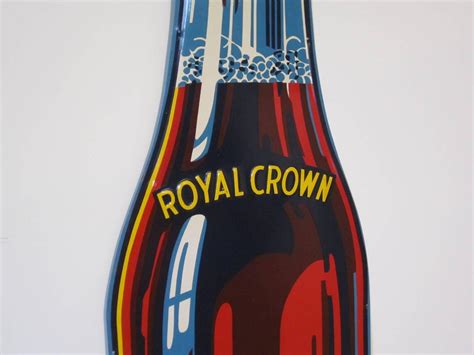 A cola is a sweet carbonated drink, usually with caramel flavoring and containing caffeine. Vintage Metal Royal Crown Cola Bottle Sign at 1stdibs