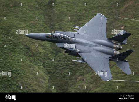 Usaf F 15e Strike Eagle Flying Low Level Through The Mach Loop In Wales