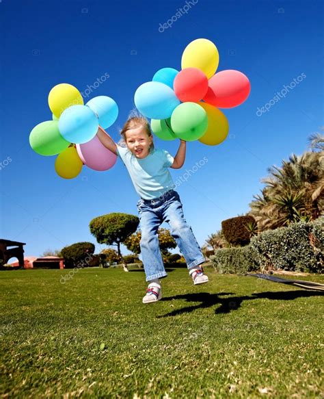 Kid Playing With Balloons In Park — Stock Photo © Poznyakov 5736087