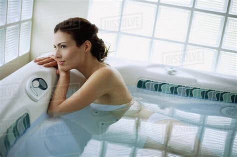 Woman Wearing All White In Jacuzzi Stock Photo Dissolve