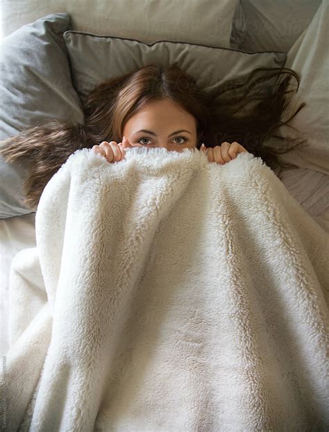 Teen Girl Hiding Under The Covers By Stocksy Contributor Carolyn