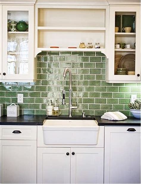 Grey cabinets and a white marble countertop look elegant alongside a green and metal mosaic backsplash for a modern space kitchens. Update Your Backsplash | Green backsplash, Kitchen ...