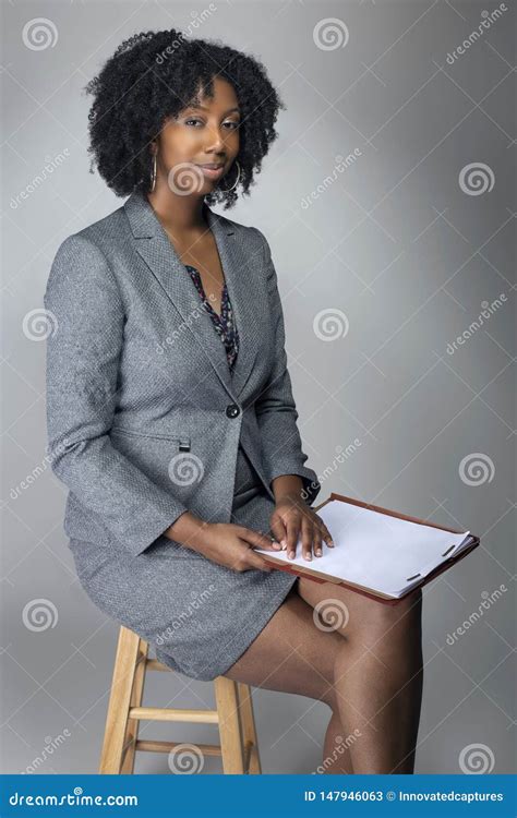 Black Female Business Woman With Contracts Or Reports Stock Image