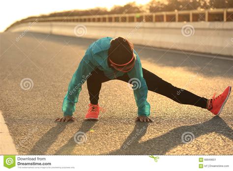 Female Runner Stretching Her Legs On Sunrise Road Stock Image Image