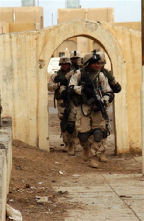 Us Army Soldiers Move Towards An Apartment Complex