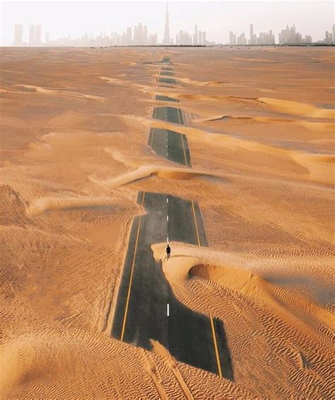 A Road In Dubai Covered In Sand Rpics