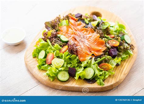Raw Smoked Salmon Meat Fish With Fresh Green Vegetable Salad Stock