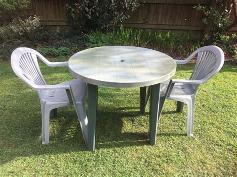 Stiff, hard, tough lightweight plastic. Small Round Plastic Table Chairs In Bridgend Outside ...