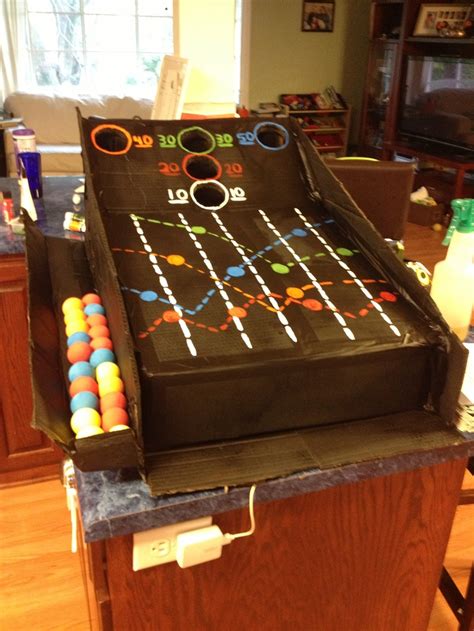 This can be recreated on a pi. Cardboard box skee ball machine. Spray painted. | Cardboard art projects, Cardboard crafts ...