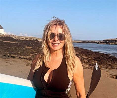 Carol Vorderman Sends Fans Wild As She Poses In Unzipped Wetsuit As She Hits The Beach At Sunset
