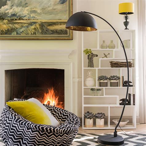 An arc lamp is a classic throwback from the 80s but still has plenty of functionality today. How to Use Arc Floor Lamps on Your Reading Corner