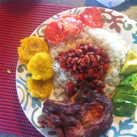 I usually get the goya sazon (or gayon sazon y culantro y achiote). Rice and beans, fried plantains and pork chop (Chuleta ...