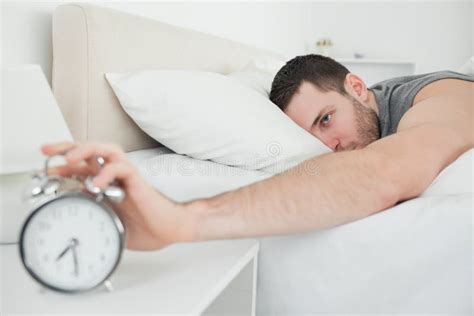 Sleeping Man Being Awakened By An Alarm Clock Stock Image Image Of Clock Front 22142969