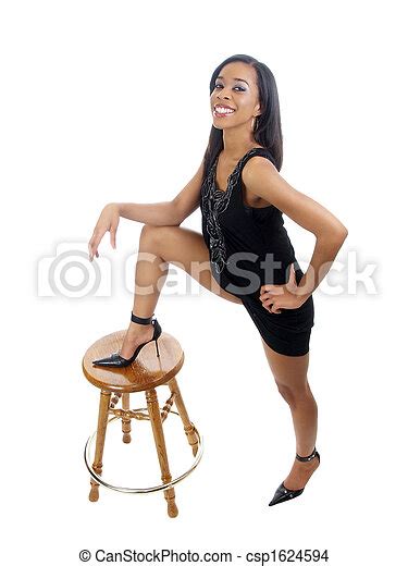 Young Black Woman With Foot On Top Of Stool Young Black