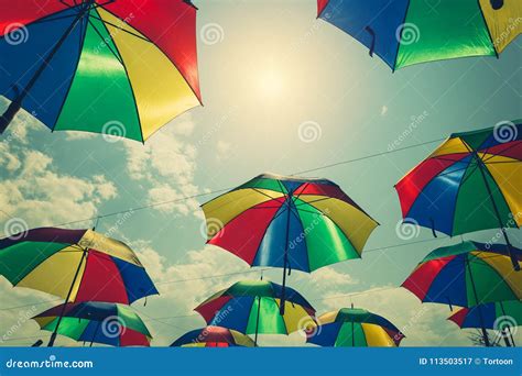 Colorful Umbrellas Hanging Above The Street With Vintage Tone