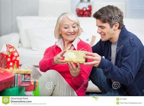 Check spelling or type a new query. Son Giving Christmas Gift To Mother Stock Image - Image of ...