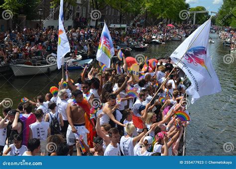 amsterdam netherlands august 06 2022 many people in boats at lgbt pride parade on river