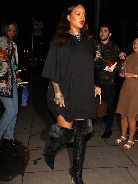 Rihanna Stuns In Over The Knee Boots As She Touches Down In London