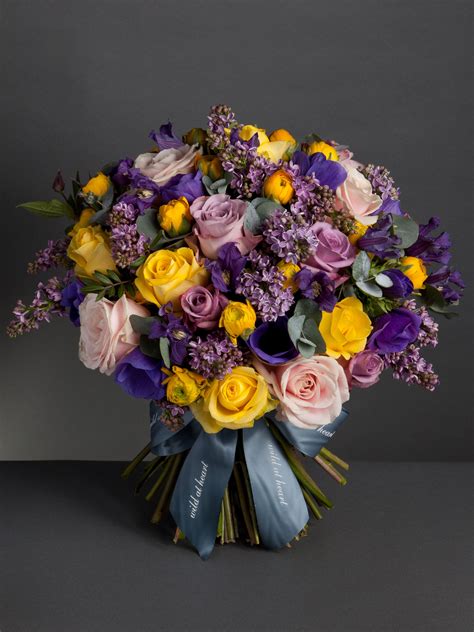 A Stunning Bouquet With Contrasting Mix Of Purple Yellow Pink And