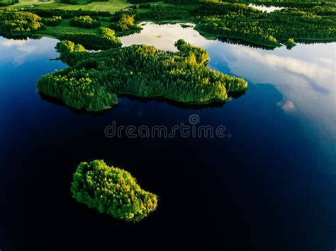 Aerial View Of Blue Lakes And Green Forests On A Sunny Summer Day In