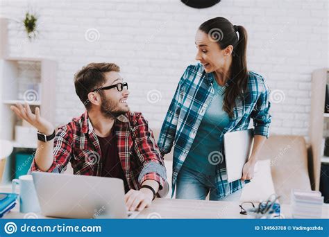 Couple Of Young Freelancers Working At Home Stock Photo Image Of