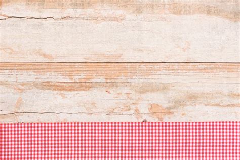 Old Wood Table Background With Red Checked Picnic Tablecloth Stock