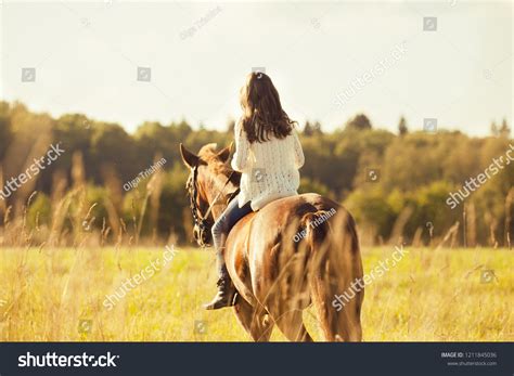 Young Girl Sitting Astride Sorrel Horse Stock Photo 1211845036