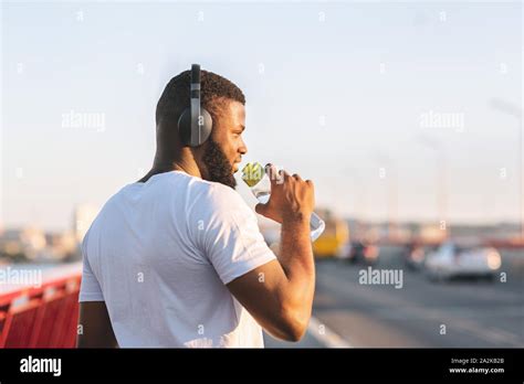 Back View Of African American Young Man Drinking Water Stock Photo Alamy