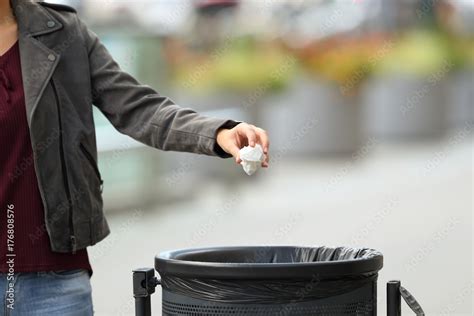 Lady Hand Throwing Garbage To A Trash Bin Stock Photo Adobe Stock