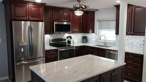 Rich Cherry Raised Panel Cabinetry By Kith Kitchens Is Complemented By