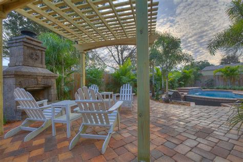 Outdoor Living With Pergola Tropical Patio Tampa By Landscape