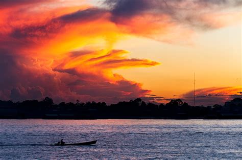 Sunset Over The Amazon River Near Leticia Colombia By Pedro Szekely