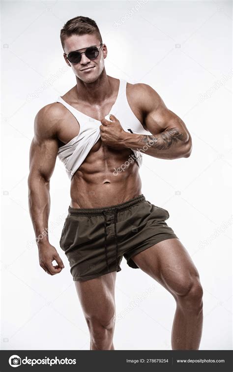 Strong Athletic Man Shows Body Stock Photo By Italo