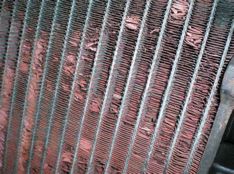 Cleaning the sharp metal fins inside remove loose debris from between the radiator fins with the wet vac. cooling system - How can I tell if my radiator is bad ...